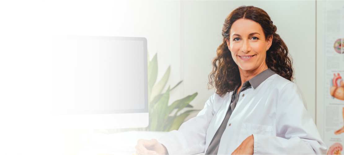 A FreeStyle Libre System Healthcare Professional smiling.