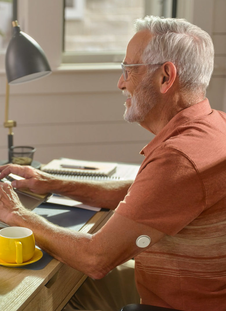 Woman on the phone checking her phone for glucose levels