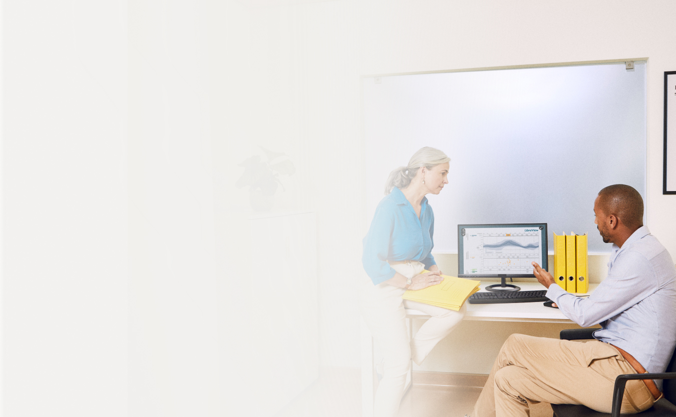 A health care professional explaining data findings to another health care professional