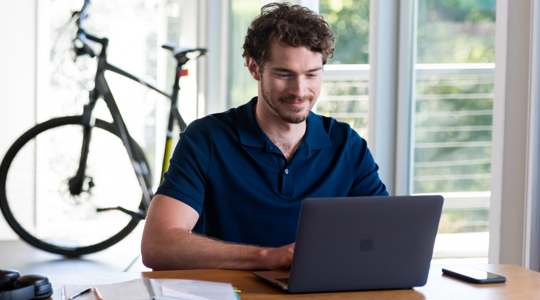 A FreeStyle Libre System user on a laptop.