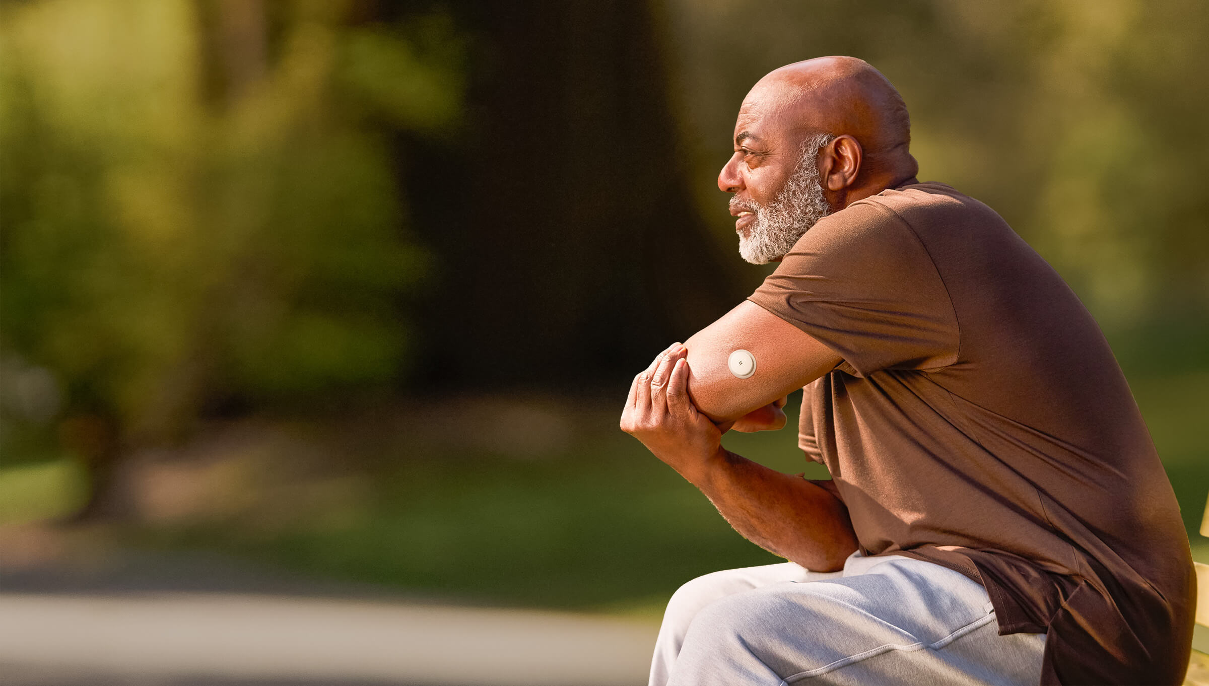 A FreeStyle Libre patient with Libre 2 plus sensor visible on the back of his upper arm