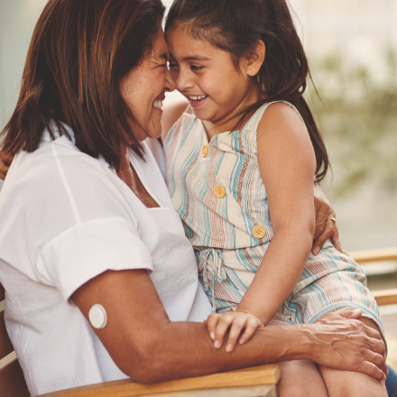 Mother with sensor and daughter