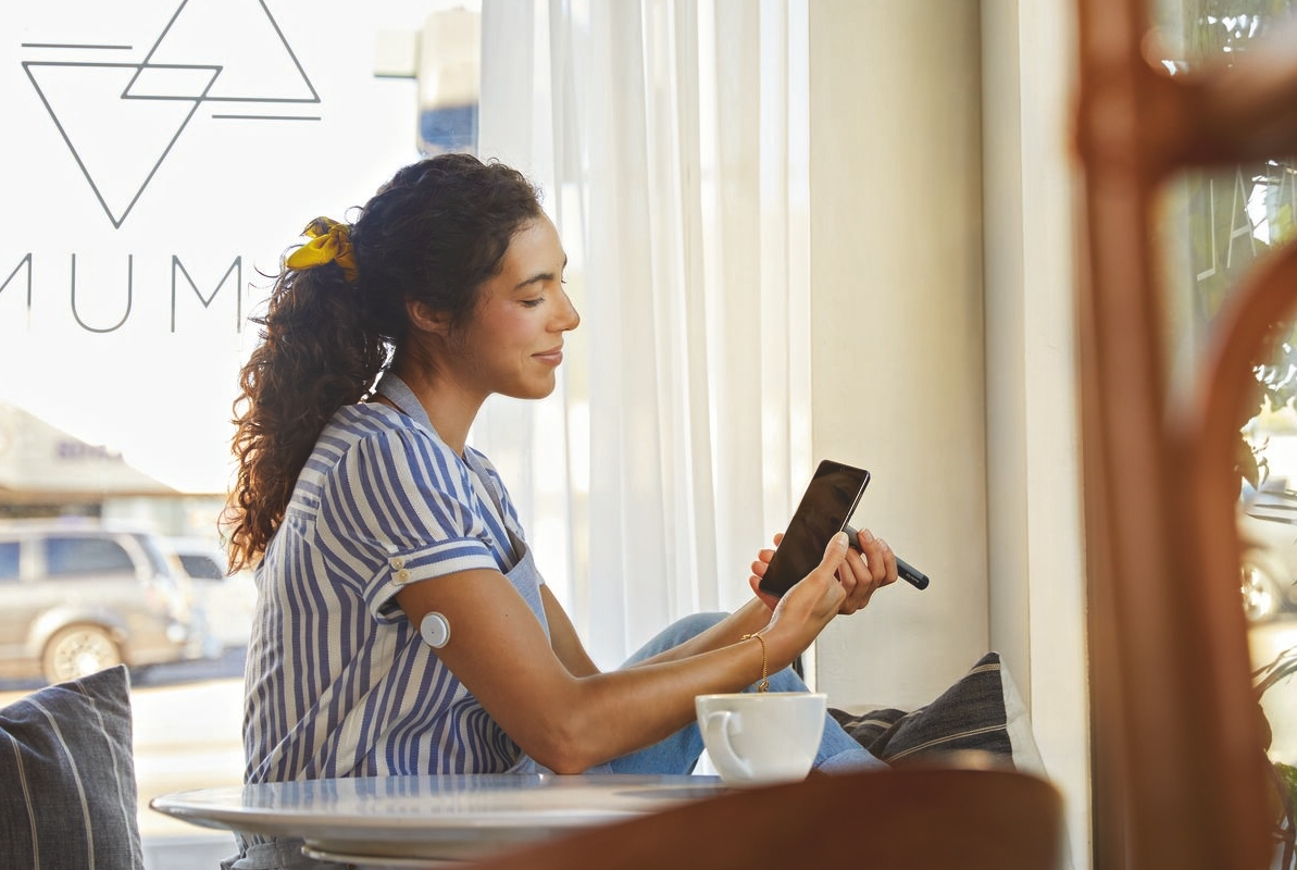 Woman scanning her phone using NovoPen