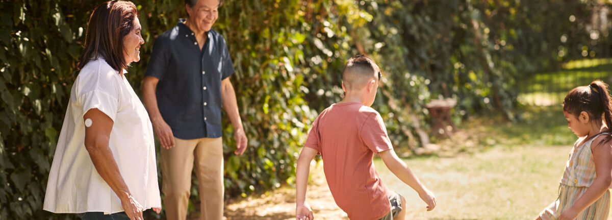 Woman and child smiling outdoors