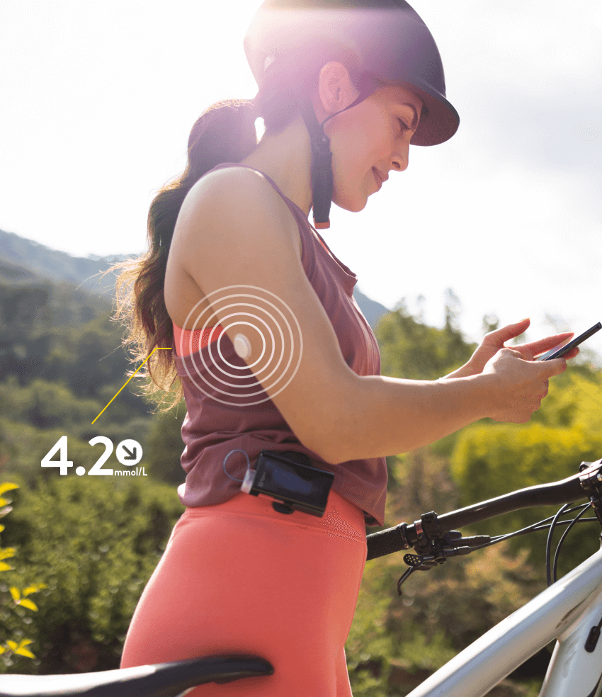 A FreeStyle Libre user scanning a connected insulin pen on her smartphone