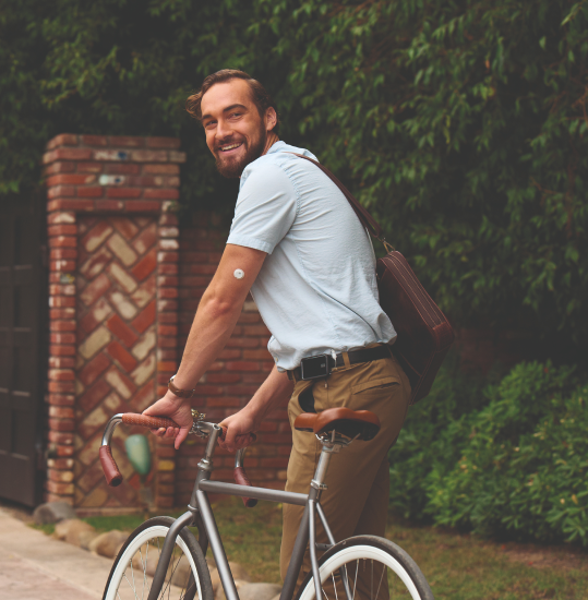 man wearing an FSL3 sensor and grabbing his bicycle