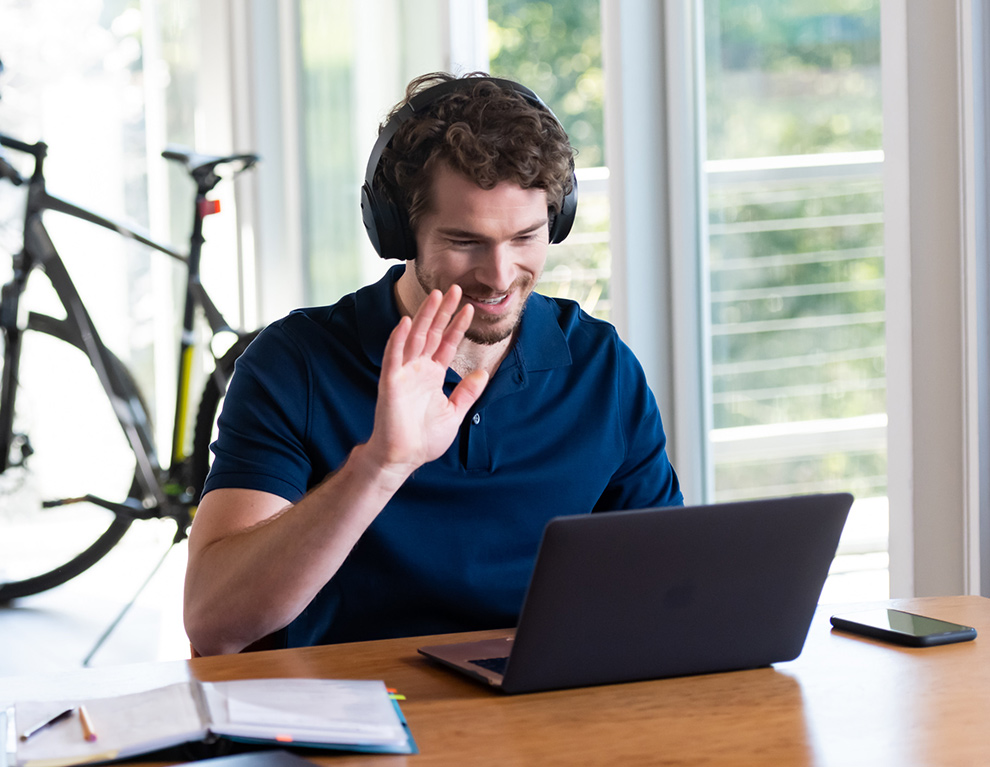 Man attending training on a laptop.