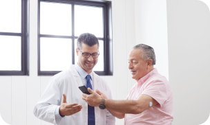 Healthcare professional reviewing glucose data with a patient